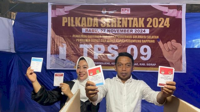 Syaharuddin Alrif Bareng Istri Saat Ikut Mencoblos